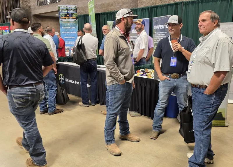 Attendees talking with exhibitors at Crop Consultant Conference 2026